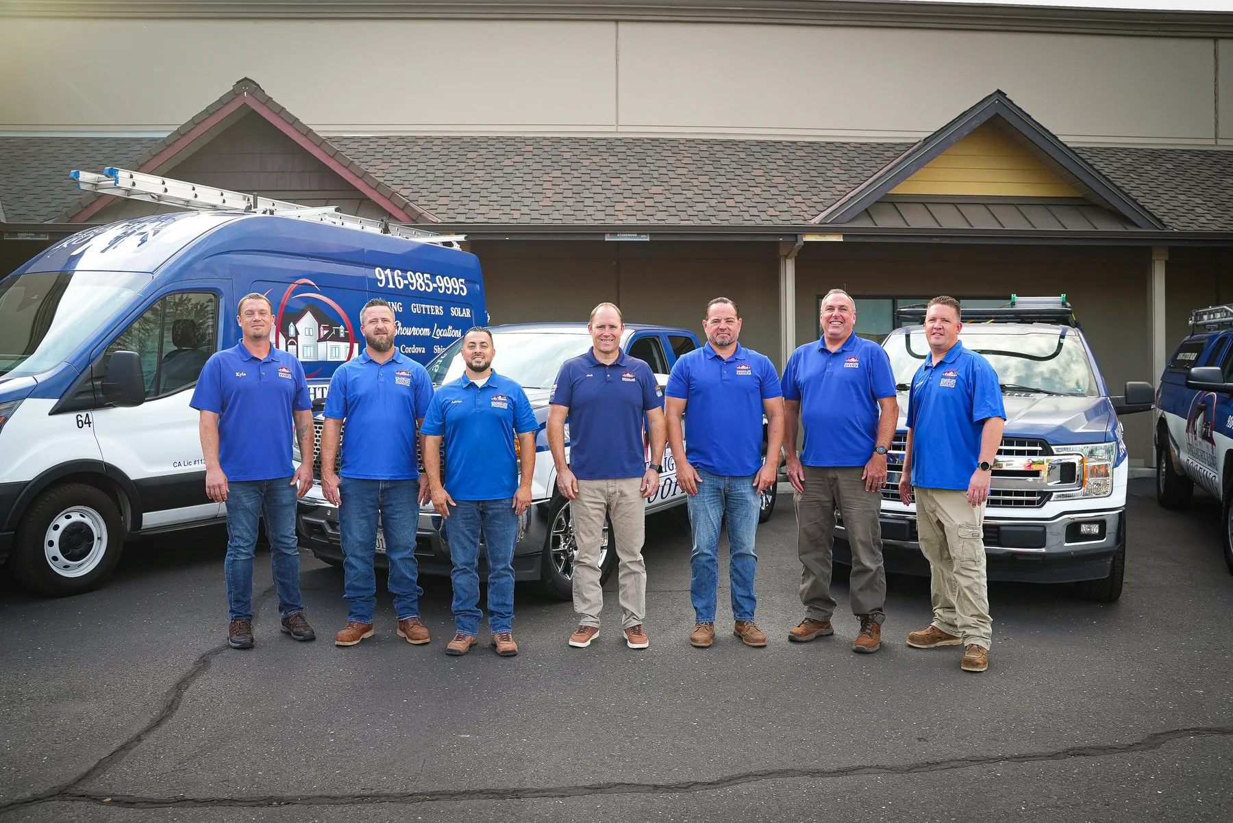 The Straight Line Roofing and Construction estimator team outside their showroom