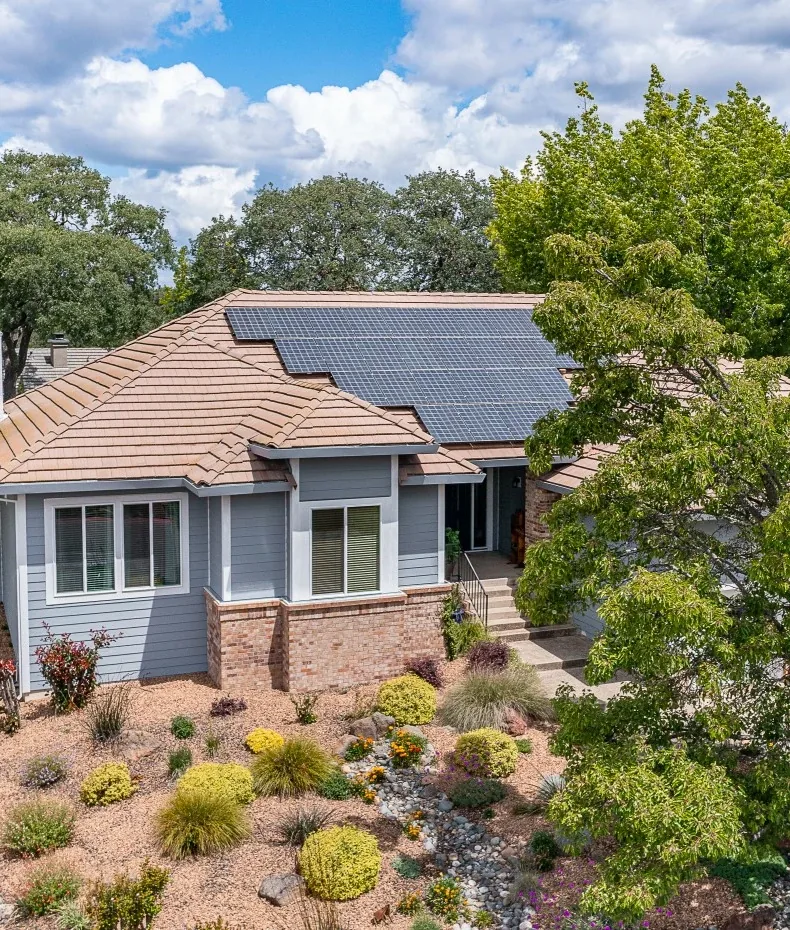 An aerial view of a Northern California home with a full rooftop solar array
