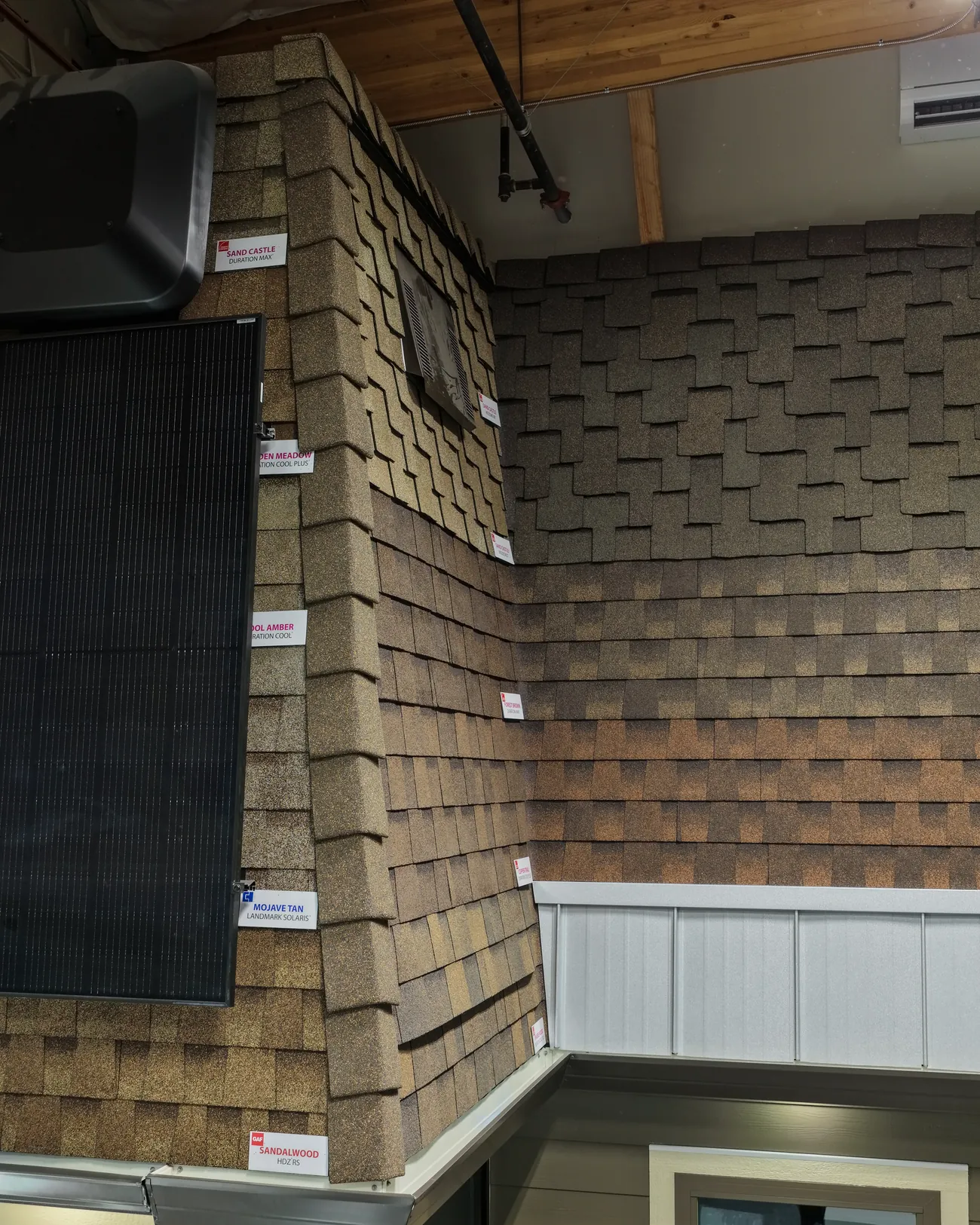 Windows, trim and siding meeting on a finished corner elevation