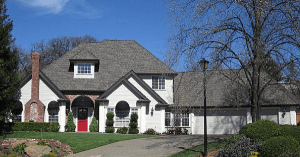 dark gray composition shingles on a white home