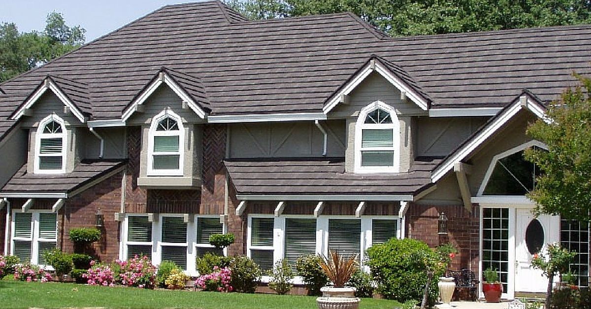 a shingle roof replacement on a brick and timber sided home.