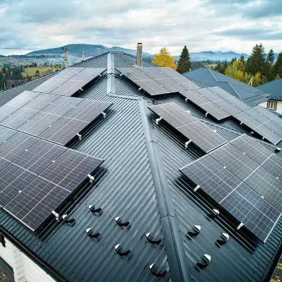 Image of black metal roof with solar panels