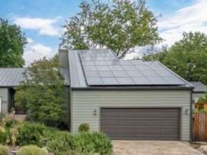 Hillside Home gage view showing solar Roofing
