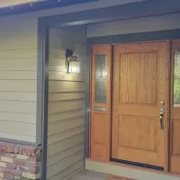 Image of front entry door & new siding