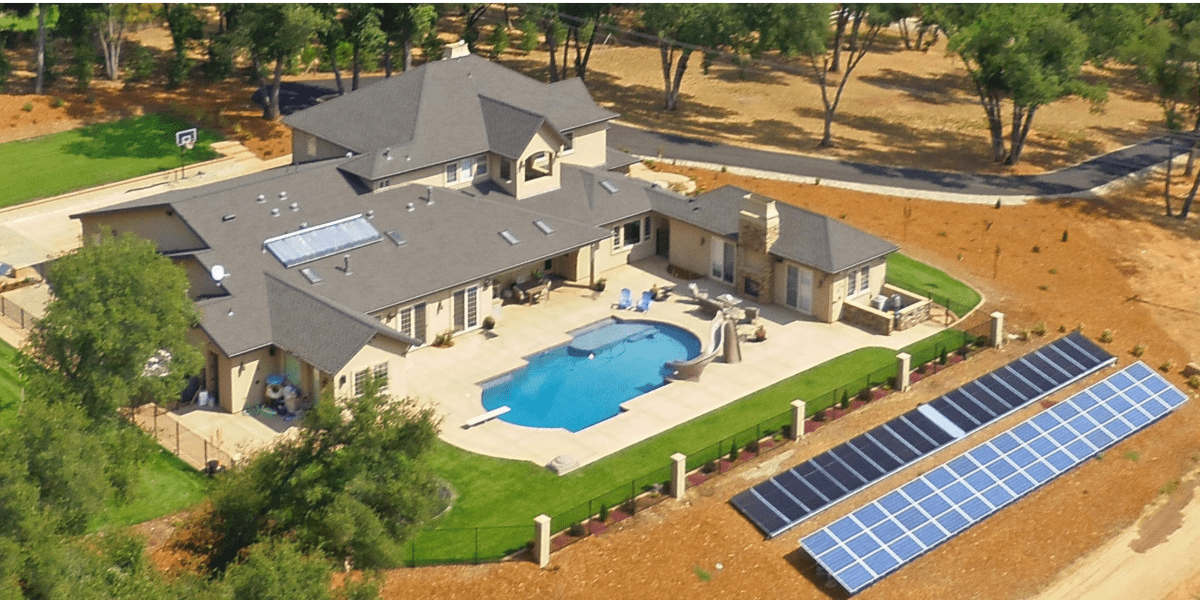 Straight Line Construction quality construction of a roof on a beautiful home with a pool and solar panels