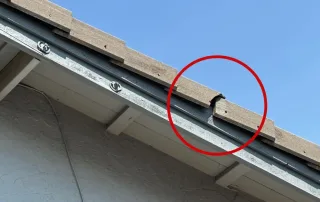 Broken wooden shake on edge needing roof repair in Sacramento